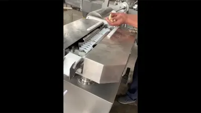Máquina para enlazar y colgar salchichas